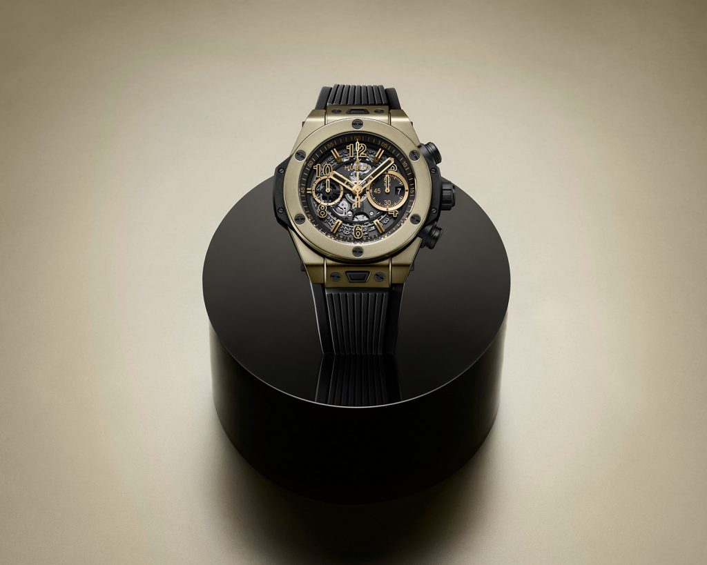 Gold and ceramic case watch with skeleton dial