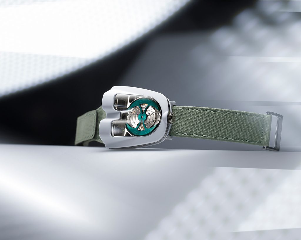 White and titanium cased watch with digital display on green strap