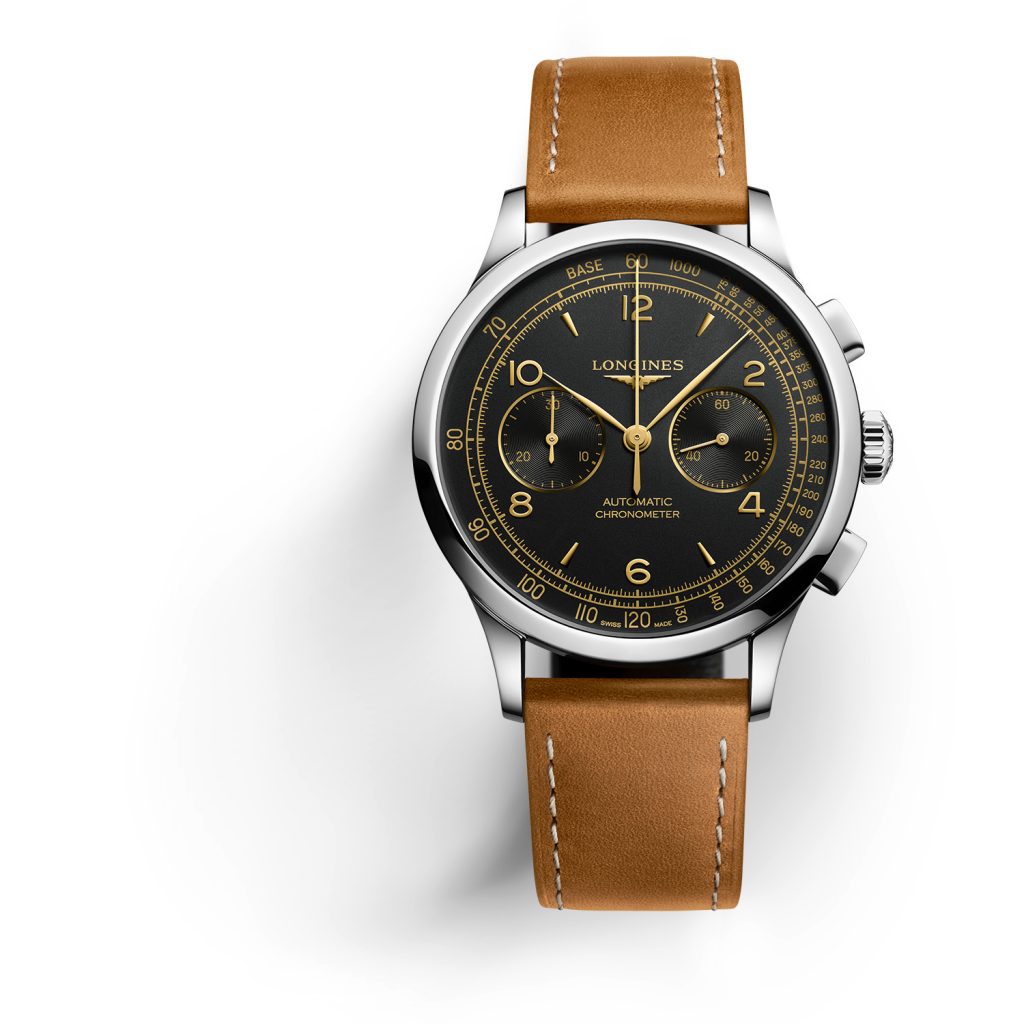 Chronograph watch with black dial and gold markings in steel case with brown strap