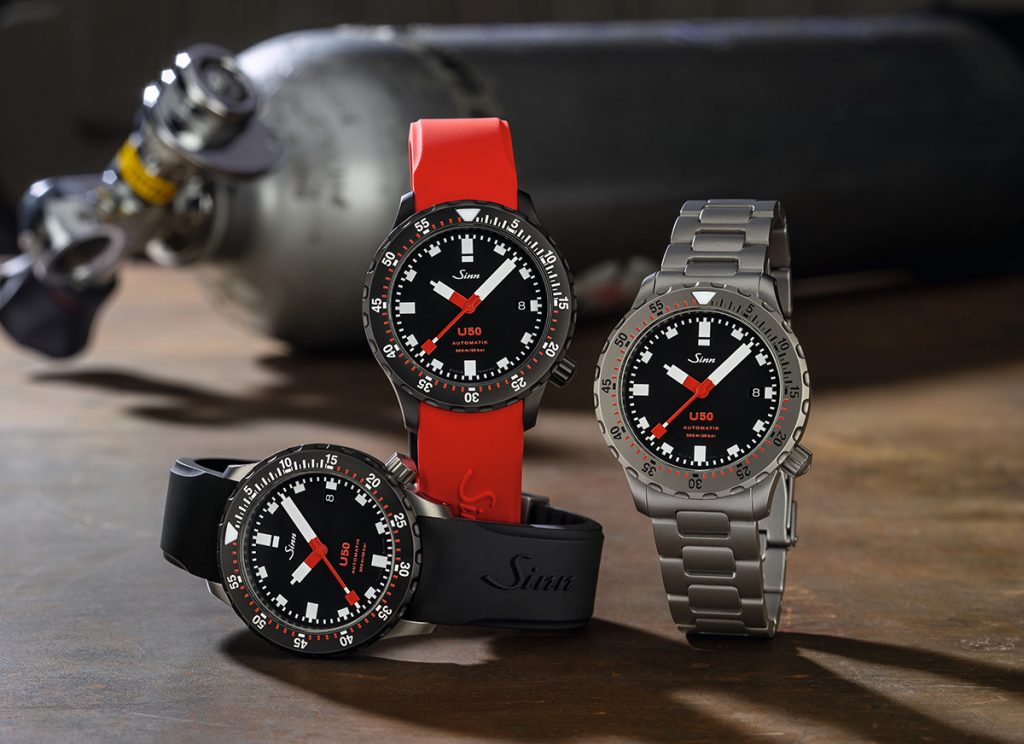 3 divers watches with black dials