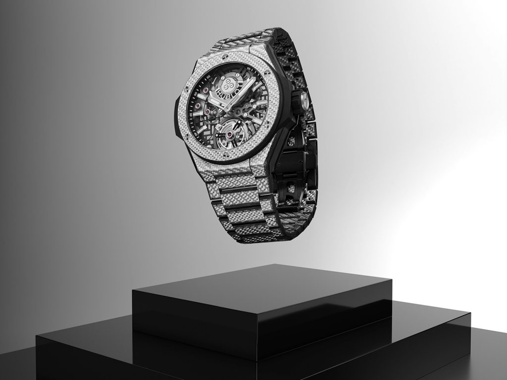 Titanium watch with striped pattern suspended in mid air