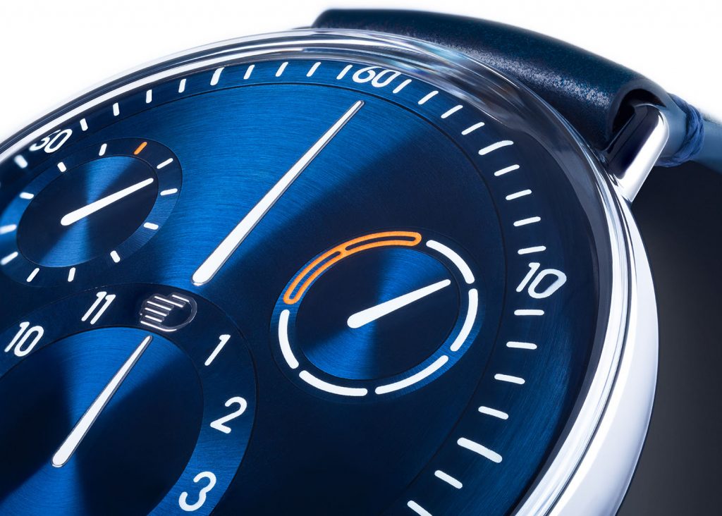 Close up of a sunray blue dial with lumed hands