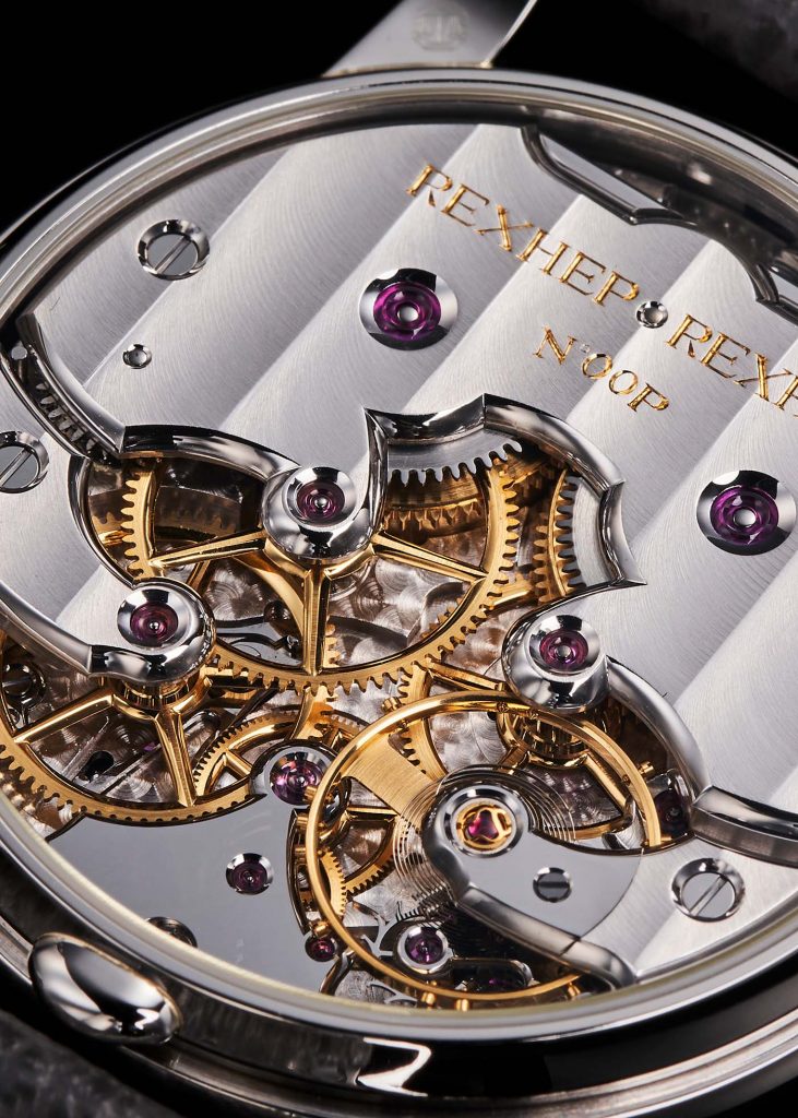 Watch movement with silver bridges and plates and gold coloured wheels