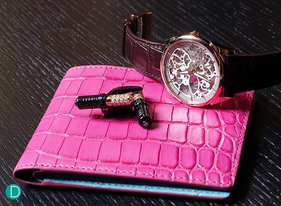 Watch by Parmigiani Tonda Skeleton, cuff links by Roland Iten, and crocodile wallet by Ethan K.